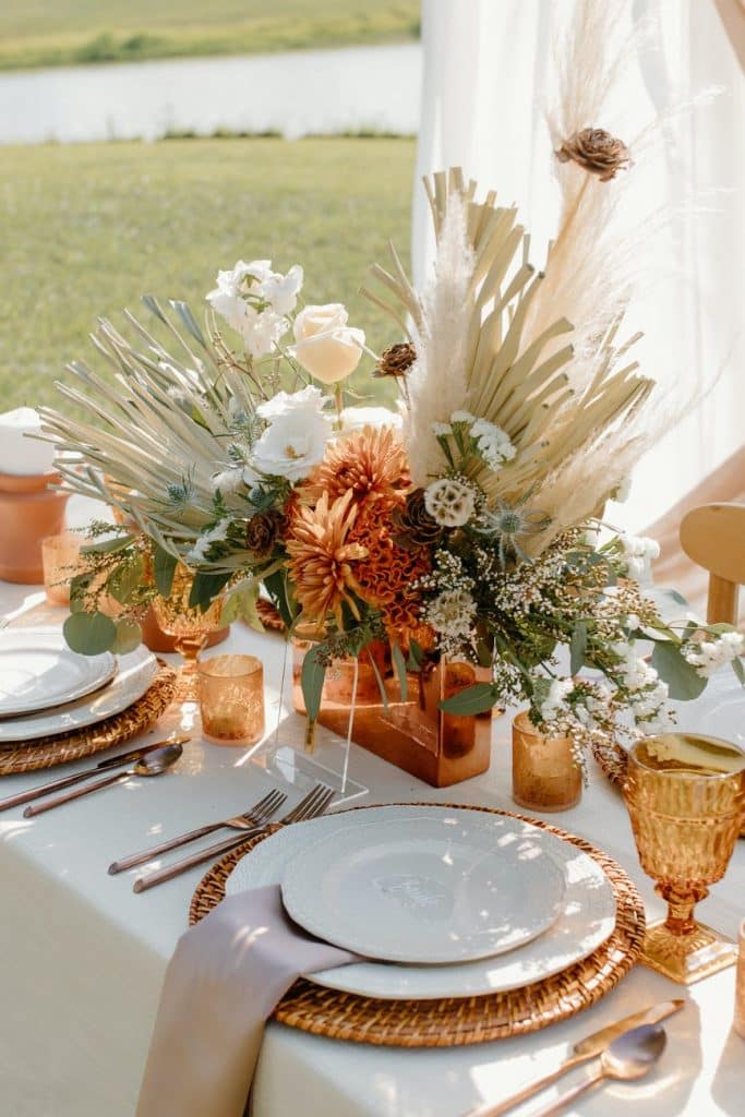 white and brown flowers on brown wooden vase
